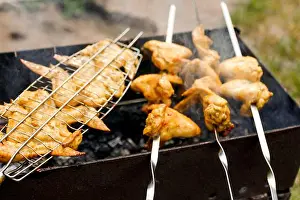 Flames Prints: Blurred delicious chicken wings barbecue on hot grill