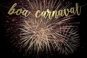 Rio De Janeiro Prints: Boa Carnaval, Portuguese for Happy Carnival message in elegant shiny gold script strung in front of golden fireworks