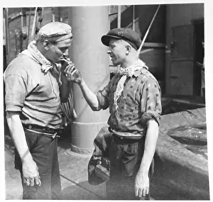 ON BOARD AN AFRICAN BOUND SHIP IN CONVOY - Typical of the men that go down to the sea in ships. Firemen come up on deck for a breather