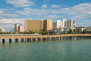 Condominiums Prints: Boardwalk over the lake with brackish water near the buildings in Destin