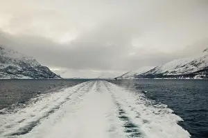 Brim Prints: Boat trail on arctic fjord in the Lyngen Alps in northern Norway on overcast day