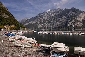 Lake Como Prints: Boats at Valmedrera harbour on Lake Como, Italy, with mountains