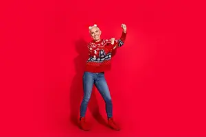 Antlers Prints: Full body photo of attractive senior woman deer horns dancing have fun dressed theme party sweater isolated on red
