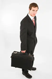 Suitcase Prints: Side full body view of a man in black suit pants
