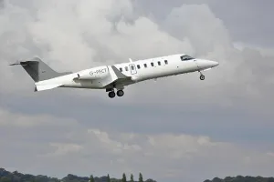 Departing Prints: Bombardier Learjet 45 G-PFCT taking of at Luton Airport, UK
