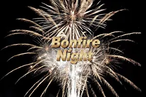 Slow Motion Prints: Bonfire Night text with glowing gold calligraphy and fireworks with fiery bursting rockets on black background