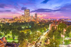 Boston, Massachusetts, USA downtown skyline over the park at dusk