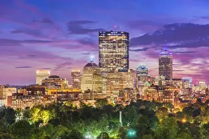 Boston, Massachusetts, USA downtown skyline over the park at dusk