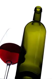 Elevated View Prints: Bottle of red wine with a glass of red wine