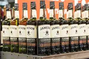 Booze Prints: bottles of Jameson whiskey on display and for sale at a liquor store