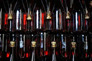 South Downs Prints: Bottles of sparkling Rose wait to be labeled at the winery of Hambledon Vineyard situated on the South Downs near
