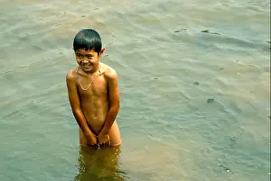 Cooling Prints: Boy cooling off in the Mae chem river on a very hot day on 13/03/2009 in chiang mai Thailand
