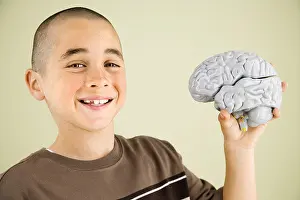 One Boy Only Prints: Boy holding human brain model