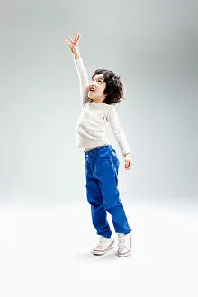 Reach Prints: a boy jumping to reach something