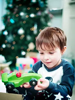 Presents Prints: Boy opening christmas presents