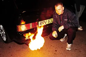 Flames Prints: A Boy Racers Escort Flames from The exhaust Caused by a spark plug placed in the exhaust