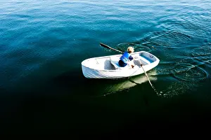 Rowboat Prints: a boy rows a boat off an island in maine