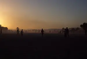 Yemen Prints: Boys playing football in the sand at sunset, Shibam, Hadramut