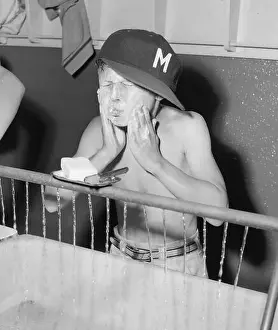 Cleanliness Prints: Boys wash up at a basin in a camp setting in California, ca. 1960