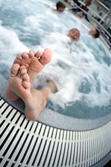Sticking Prints: Boy's Wrinkled Feet Sticking out Hot Tub