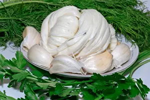 Caucasus Prints: Braided Caucasian Chechil cheese, garlic, and fresh herbs. A traditional appetiz