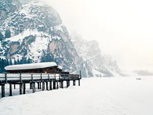 Crystal Clear Prints: Braies lake nestled in the snow. Magic corner of the Dolomites, Bolzano, italy