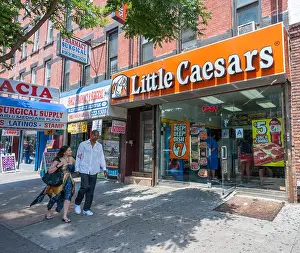 Franchise Prints: A branch of the Little Caesars restaurant chain in Harlem in New York on Saturday