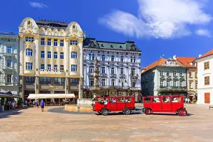 Danube Prints: Bratislava, Slovakia - July 5, 2017: View of the main square and historic vehicle for tourists