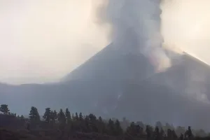 Magma Prints: Breathtaking aerial view of mountain landscape with erupting Cumbre Vieja volcano emitting magma covered under thick