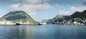Breathtaking cityscape of Klaksvik town with fjord and cloudy mountains, Bordoy island, Faroe islands, Denmark. Landscape photography