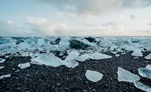 Slow Motion Prints: Breathtaking diamond beach on Iceland in winter with large ice blocks, ice cubes