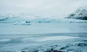 Slow Motion Prints: Breathtaking glacier in Iceland with black rock and large ice sheets