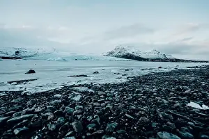 Slow Motion Prints: Breathtaking glacier in Iceland with black rock and large ice sheets