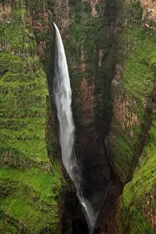 Conserve Prints: From above of breathtaking scenery of large Jinbar Waterfall with powerful stream flowing down rocky ravine