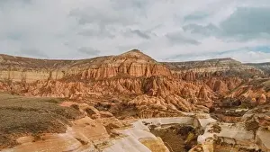Cappadocia Prints: From above breathtaking scenery of massive rocky mountains located in Rose Valley against cloudy sky in Cappadocia