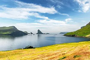 Breathtaking view on Drangarnir and Tindholmur sea stacks in Atlantic ocean, Faroe Islands. Landscape photography