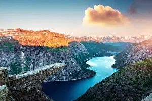 Troll Prints: Breathtaking view of Trolltunga rock - most spectacular and famous scenic cliff in Norway
