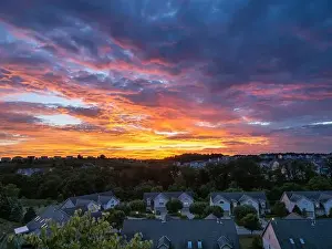 Sunset Glow Prints: A breathtakingly colorful sunset lights up the summer sky