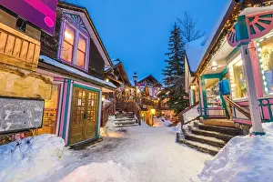 Breckenridge, Colorado, USA downtown streets at night in the winter with holiday lighting