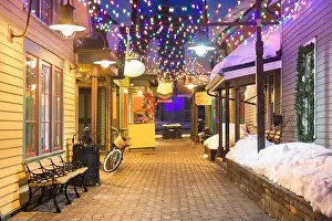 Breckenridge, Colorado, USA downtown streets at night in the winter with holiday lighting