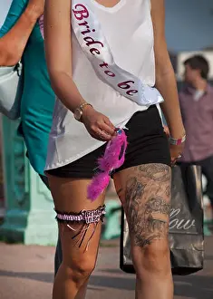 Dominic Prints: A bride to be walks along the sunny Brighton seafront