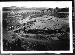 Bridge Crossing Prints: A bridge crossing takes place in 1925 in a press photograph issued by Agence Meurisse