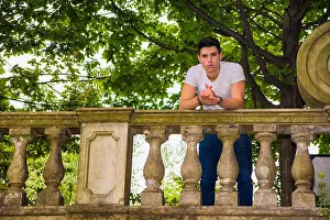 Optimistic Prints: bridge leaning on the stone balustrade smiling down at the camera