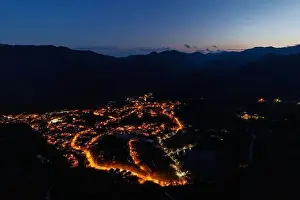 Bright sparkling mountain town of Smolyan with multi-colored night electric lights