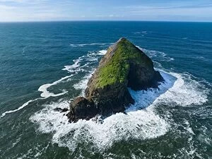 Images Dated 1st March 2023: Bright sunlight shines on a solitary sea stack off the northern coast of Oregon