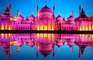 Grandeur Prints: Brighton Royal Pavilion floodlit in Pink to celebrate Gay Pride festival reflected in a pond