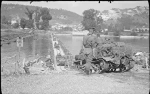 The British Army in North-west Europe 1944-45 Universal carriers cross the River Seine on a Bailey bridge at Vernon, 27 August 1944