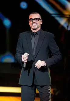 Microphone Prints: British singer George Michael performs at the O2-Arena venue in Berlin