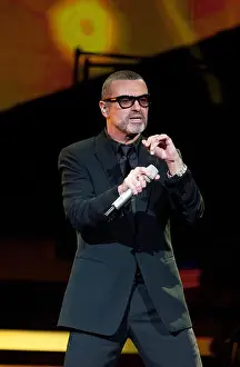 Microphone Prints: British singer George Michael performs at the O2-Arena venue in Berlin