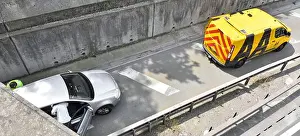 Occupations Prints: Broken down car moved from under road bridge yellow jacket AA mechanic completes job driver enters vehicle M25 motorway